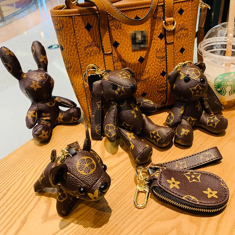 

Модный кожаный брелок для ключей в виде медведя бульдога в виде старой куклы с цветком дизайнерский кожаный брелок для ключей