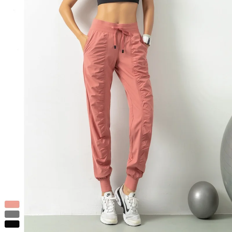 

2020 New Arrival Woman Sports Pants With Pockets Slim Fit Loose Breathable Running Cycling Fitness&Body Building Ninth Trousers