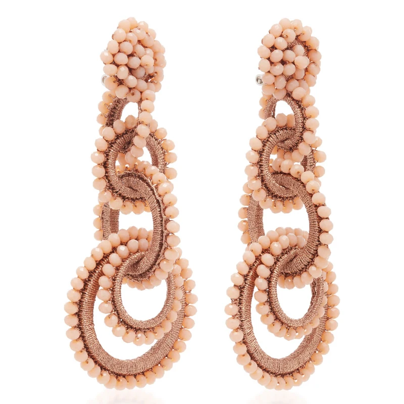 Большие серьги-подвески с перекрывающимися кольцами и кристаллами массивные