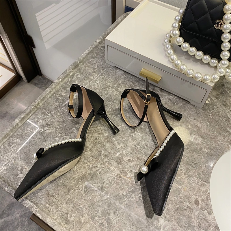 

Spring and autumn pointed toe Baotou high heels 2021 new stiletto high heel pearl design summer fairy air sandals