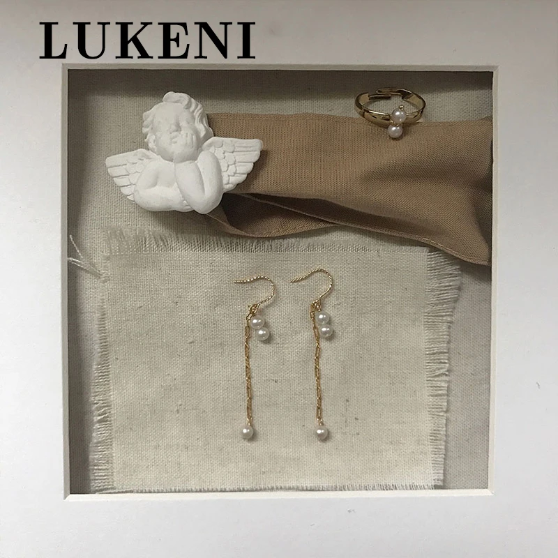 

Серьги женские из золота 14 карат, с барочным жемчугом