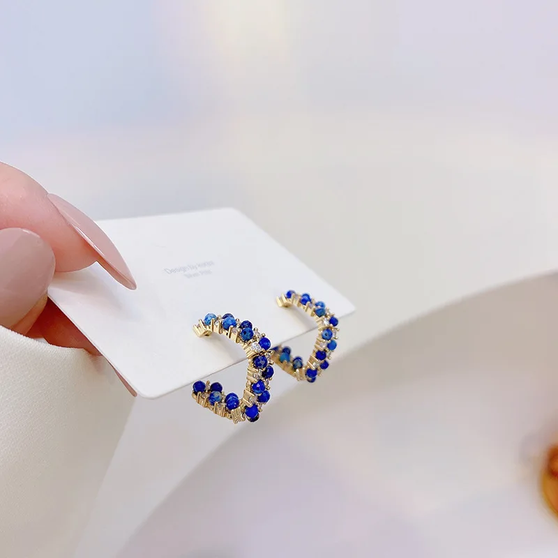 

Korean Hot Selling Fashion Jewelry Exquisite Copper Inlaid Zircon Earrings Twisted Hollow Geometric Women