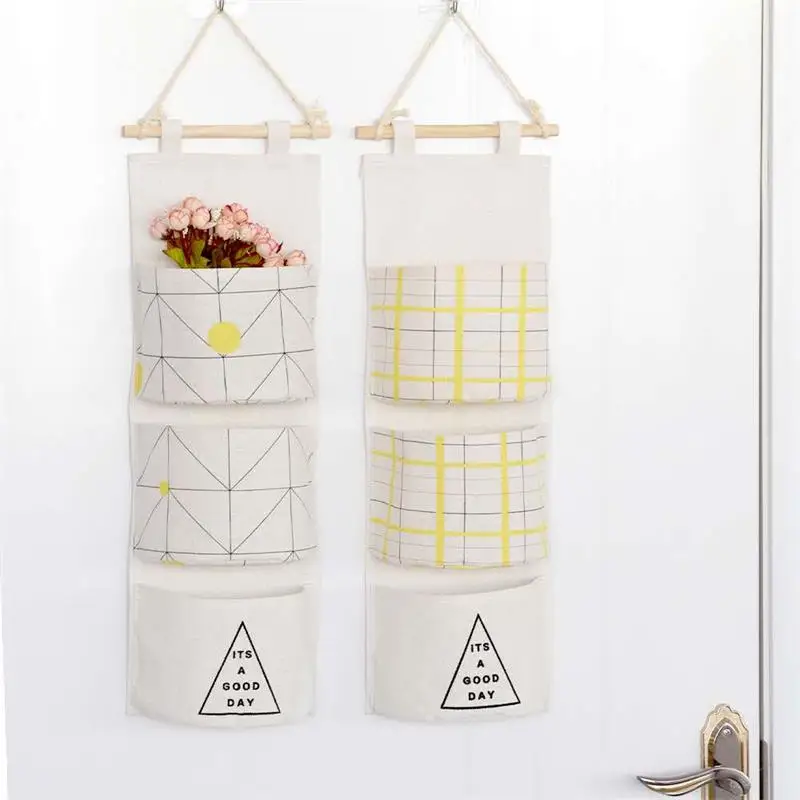 

Nordic three pocket storage hanging type cotton and linen door sundries storage bag