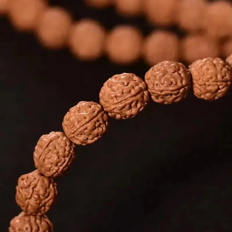 

Fine agate accessories Xiaojingang five-petal first generation Panlong 108 Buddha beads yellow skin fried meat