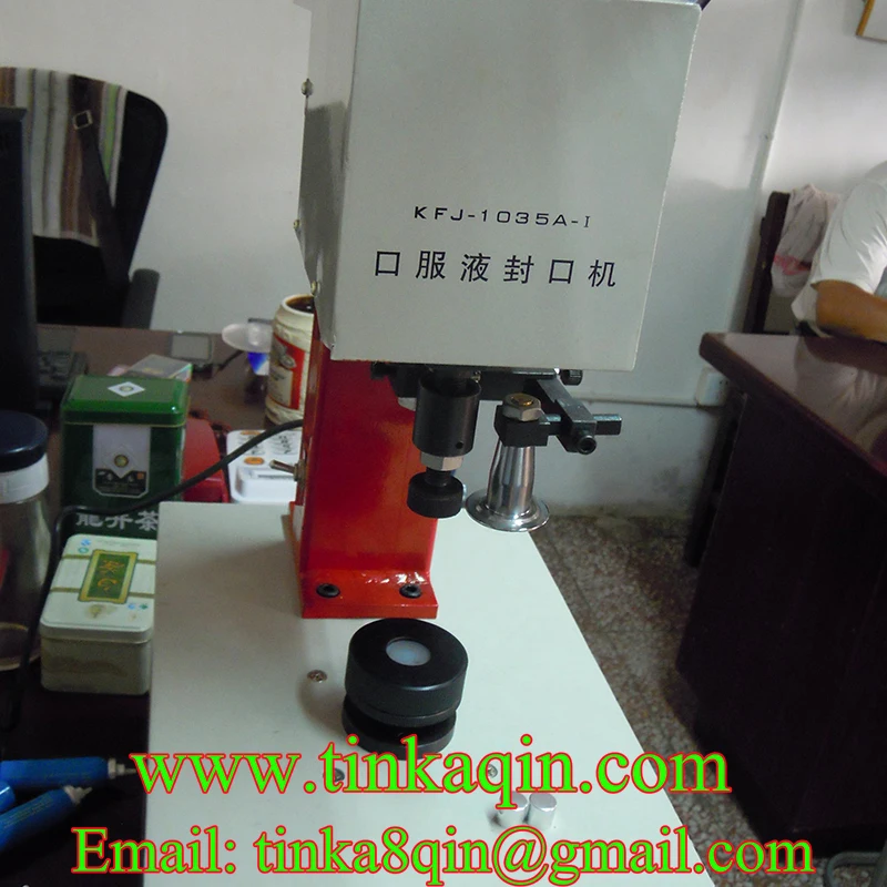 Фотоаппарат для герметизации жидкости в бутылках с металлическими крышками |