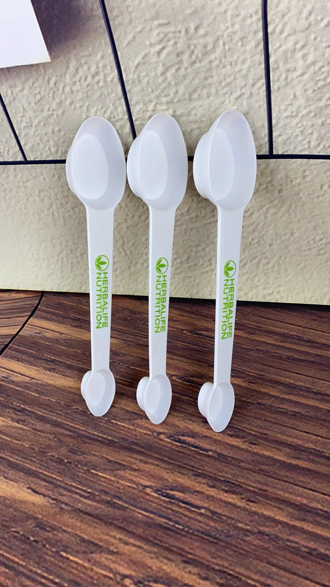 

Herbalife nutrition. Four scoops of mixed milk. Household scoops ration spoon
