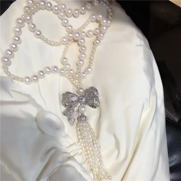 

hot sell 75cm White freshwater pearl micro inlay zircon bowknot long tassel sweater chain necklace fashion jewelry