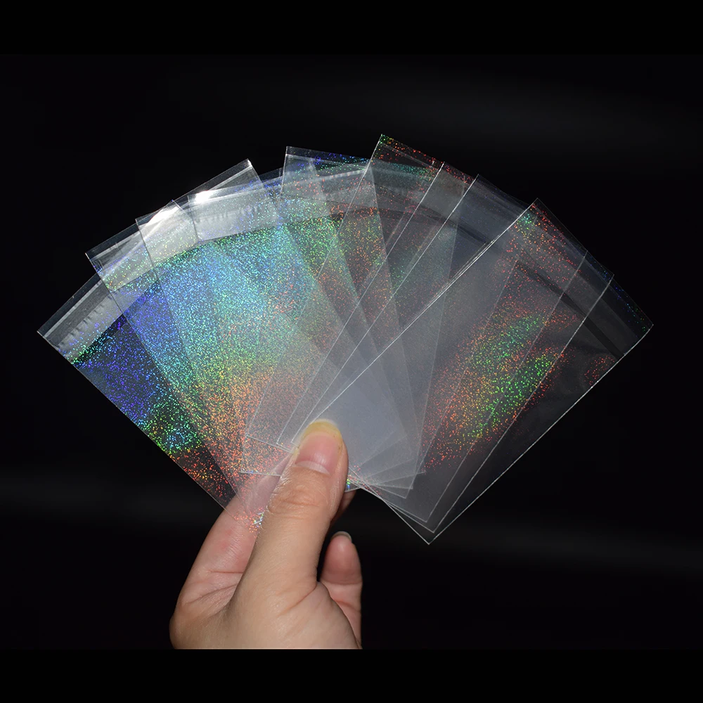 100pcs/lot 57x87mm Quicksand Flash Small Cards Transparent Laser Clear Sleeves Idol Photo Protector Trading Shield Cover | Спорт и