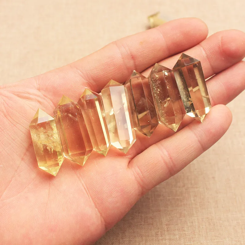 

Natural topaz hexagonal prism pendant piece double pointed crystal pillar Lingpendulum crystal healing Yu energy raw stone grind