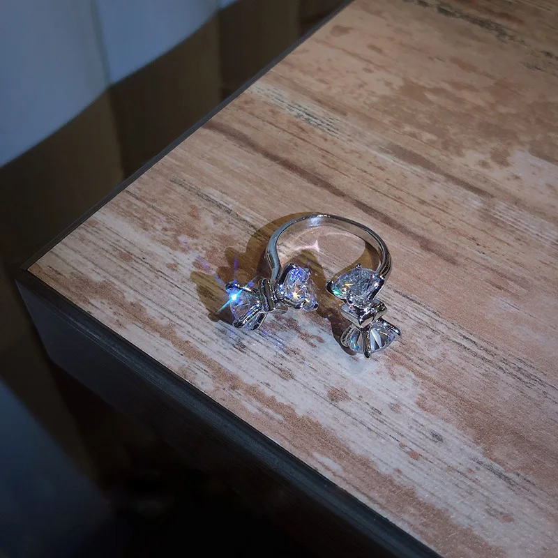 

Fashion simple personality fashion ring inlaid with diamond bowknot open ring net red temperament design sense handpiece girl