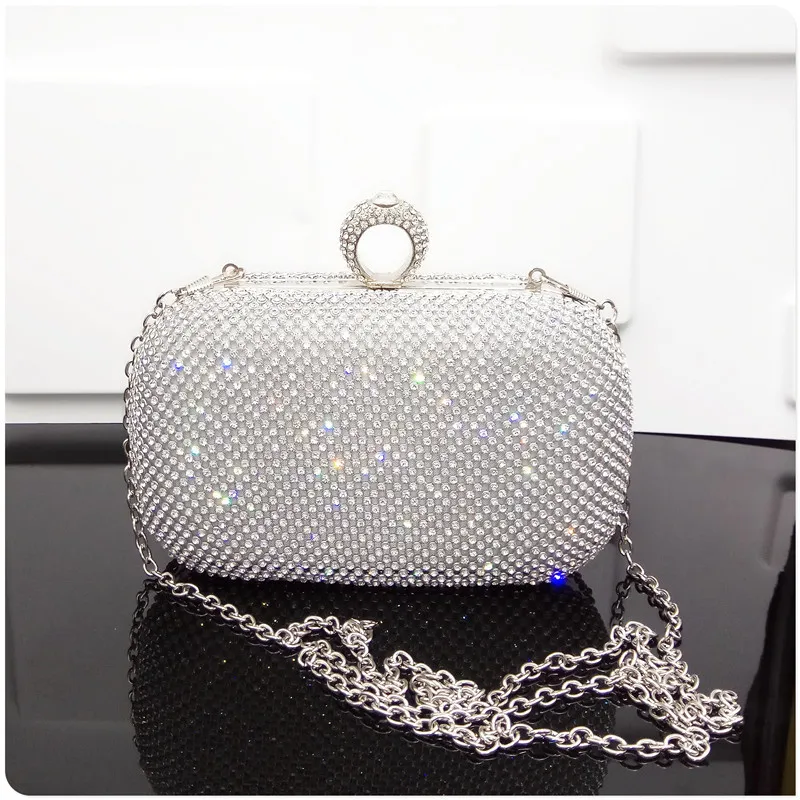 

Diamond ring, evening dress bag for party in hand.