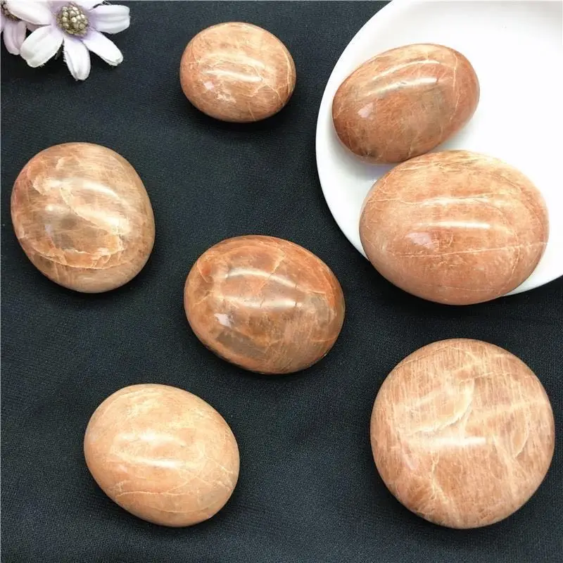 

Natural peach moonstone palm stone crystal rare healing gemstone home decoration gifts