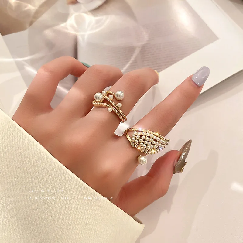 

Latest Designs Luxury Woman Crystal Gold Angel Wings Ring Zircon Cubic Elegant Ring Adjustable Opening Pearl Finger Rings