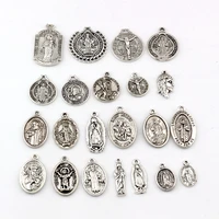 110pcs zinc alloy benedict crucifix round charms unisex diy necklace pendants religion jewelry 22 style a 617