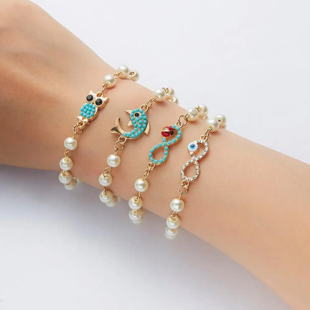

Rinhoo Fashion Wristband Simulated Pearl Link Chain Charm Bracelets Infinite 8 Owl Dolphin Blue Beaded Bangles For Women Jewelry