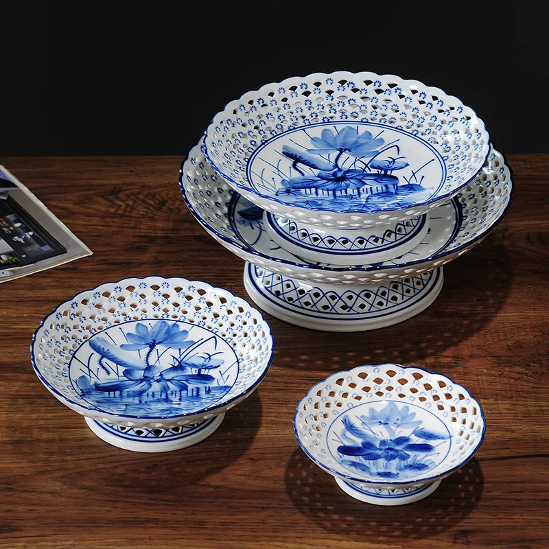 

New Chinese style plate blue and white porcelain high foot ceramic fruit plate creative hollow out retro living room Chinese