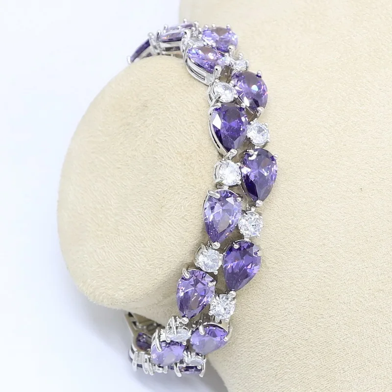 Искусственный роскошный браслет серебряного цвета с фиолетовым цирконом