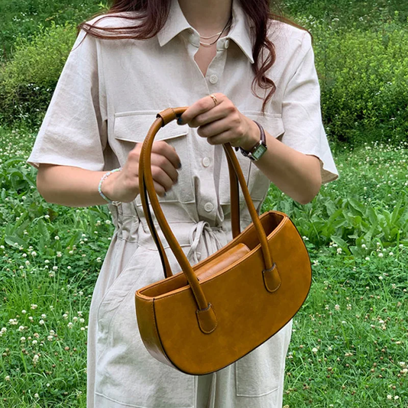 

New South Korea East Gate Armpit Bag Women's One Shoulder Retro Stick Bag Semicircular Simple Ins Portable Bag