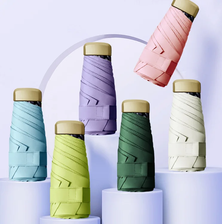 

Mini Pocket Umbrella Capsule Folding Travel Portable Men Women Student Sun Rain UmbrellaOutdoor Raining Home Umbrella DF50UM