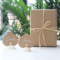 free shipping50pcsboxnatural lion shell love place card hold for beach wedding natural shell conch reception table chic decor