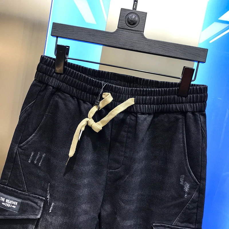 

Men's 2020 autumn new casual pants Multi Pocket simple black micro collapse jeans handsome long pants tie feet versatile men