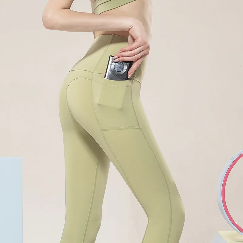 

New Sports Skinny Yoga Pants For Women Sexy Lift The Hips High Waist Running Pockets Design High Spandex Leggings Gym Pants
