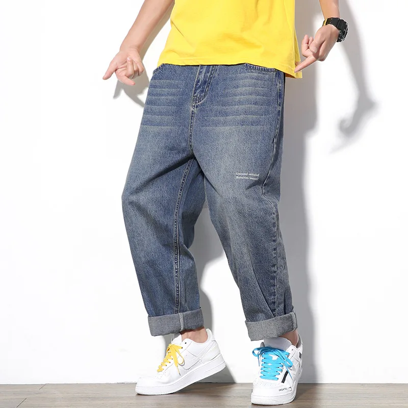 Мужские джинсы в стиле хип хоп черные однотонные рваные средней длины из хлопка