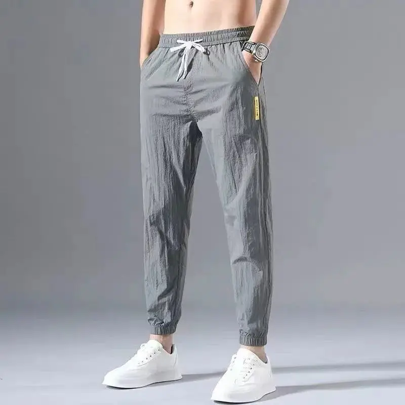

Summer ice silk quick-drying slacks male slim pants male relaxed joker sweatpants tide male nine points of the foot trousers