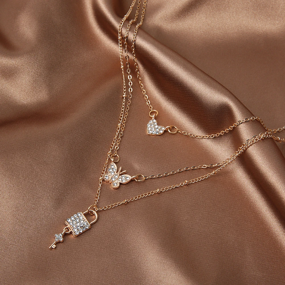 

Jewdy Fashion Lock Couple Pendant Necklace for Women Girls Love Heart Butterfly Effect Gold Dangle Neck Chain Jewelry 2020