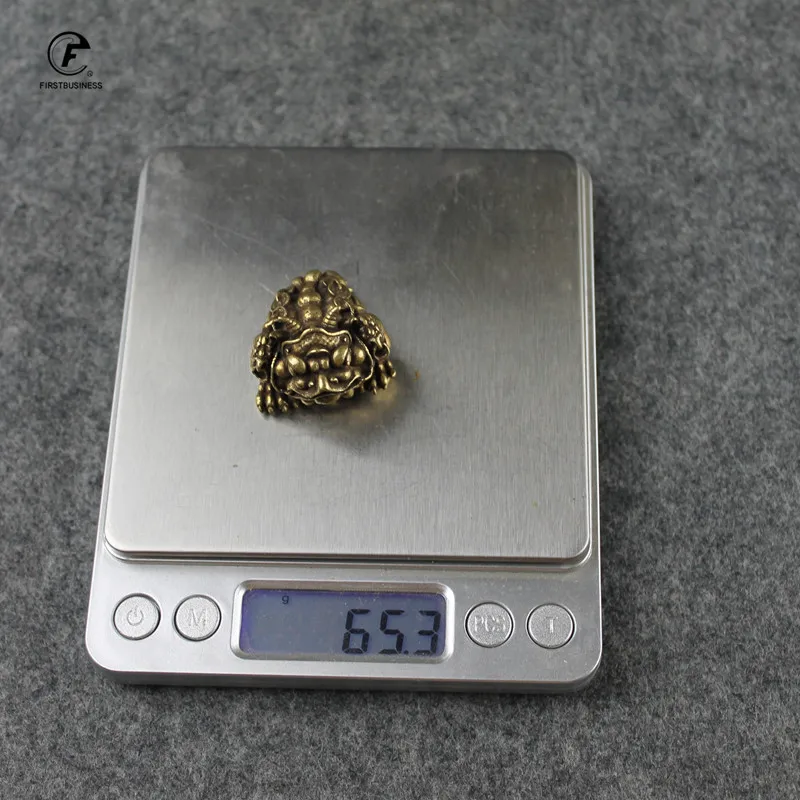 Медная статуэтка лягушки