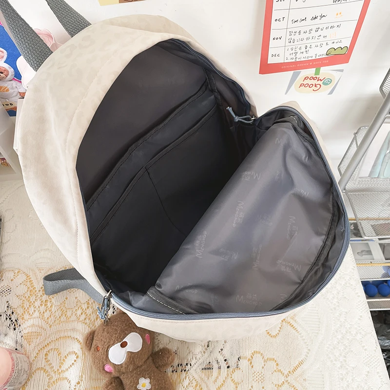 

2021 New Nylon Waterproof Fashionable Girl Backpack Korean Japanese Middle And High School Students Schoolbag Discoloration Cool