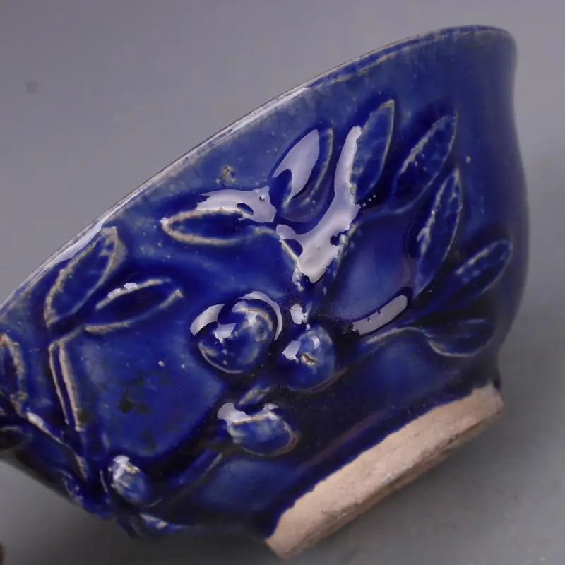 

Family decoration collection of blue glaze relief bowl with flower and fruit pattern of song Jizhou kiln