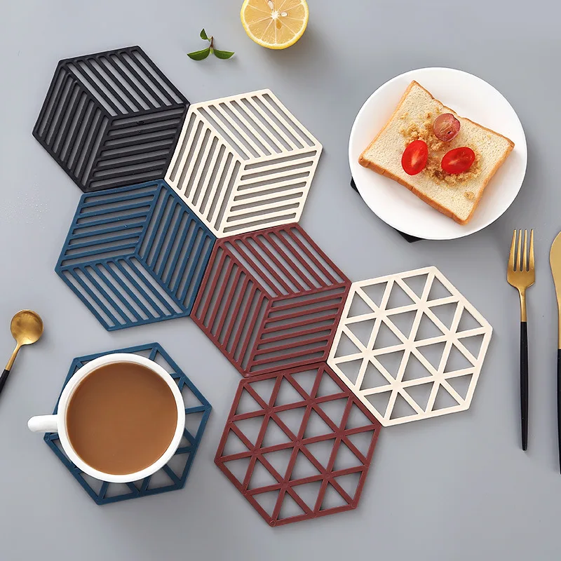

Nordic simple tableware Pad Coaster anti scalding pad kitchen tool silicone material 14 * 7cm hexagon 2 styles and various color