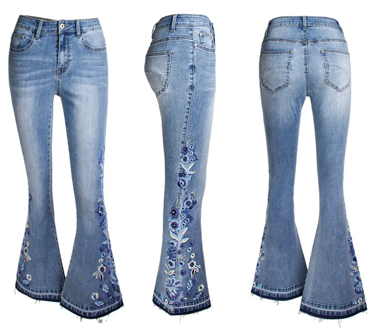 Женские расклешенные джинсы с вышивкой со скошенной юбкой синие эластичные