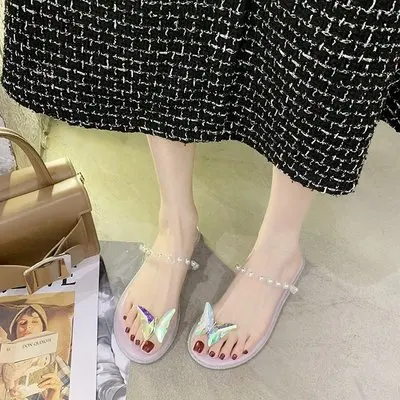 

Slippers female 2020 summer new butterfly decoration low heel set toe pearl fashion outer penetrating light