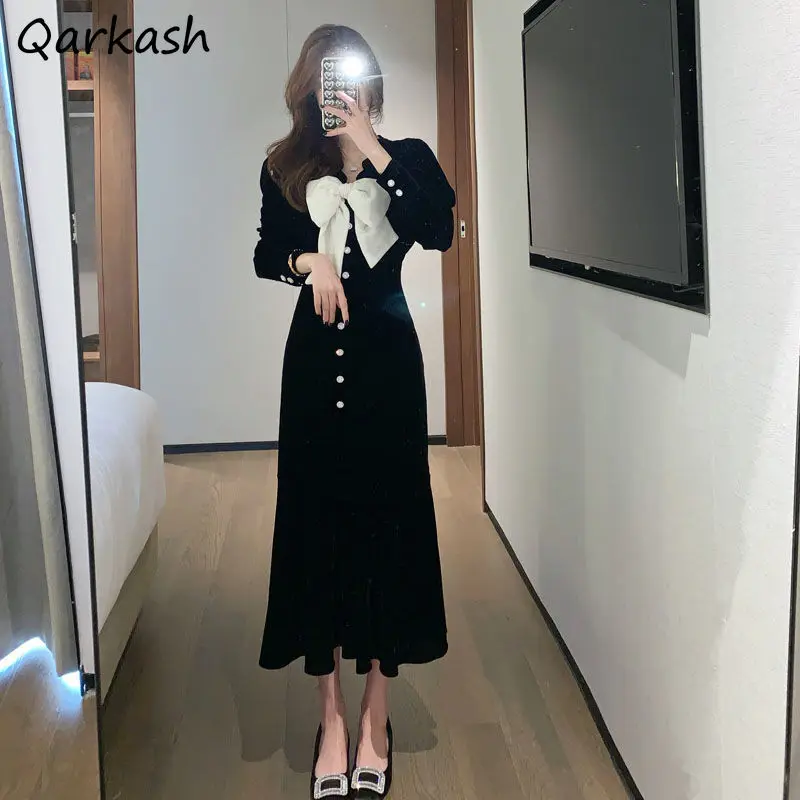 

Платье женское средней длины с длинным рукавом и бантом