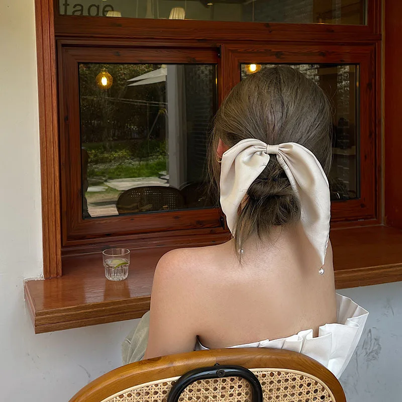 

Korean temperament pearl bow hairpin top clip wild Korean net red clip headdress hair accessory female spring clip