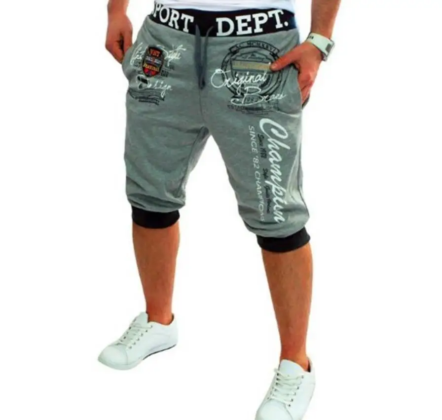 

The new summer trend of men's casual pants loose sweat pants drawstring cropped trousers printed color matching casual pants