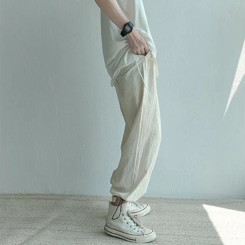 

Summer cotton and linen pants men's Hong Kong style trend versatile summer corset casual pants men's loose straight leg pants