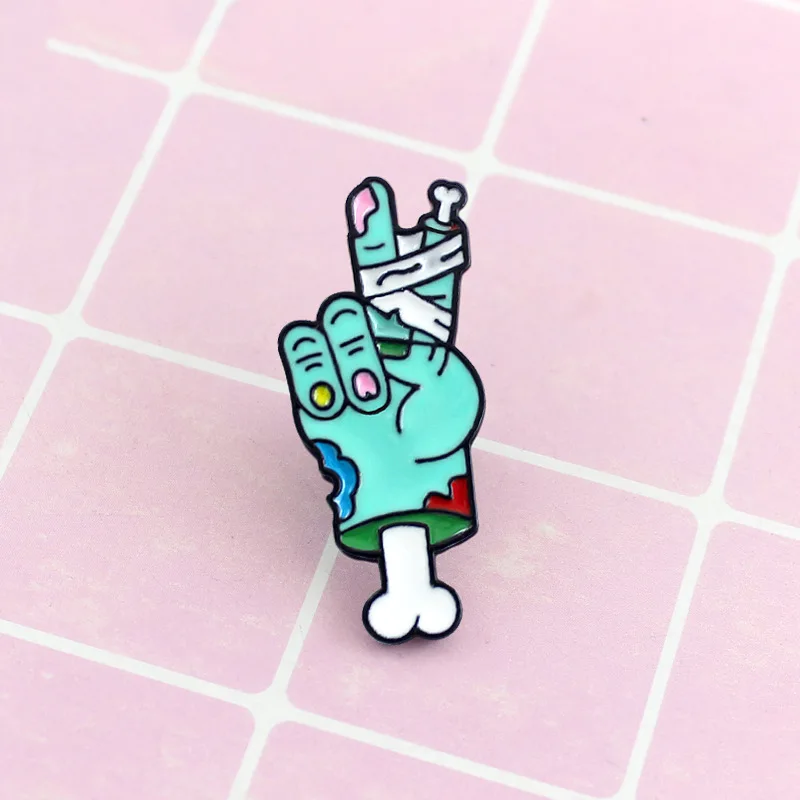 

XM-funny New blue skull hand tied bandage victory gesture dripping brooch color jewelry clothing bag accessories