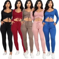 woman solid color two piece outfits ruched drawstring long sleeve crop top and high waist sporty legging sweatsuit matching set