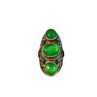 collection of ornaments of folk inlaid emerald ice egg face ring face and silver ring
