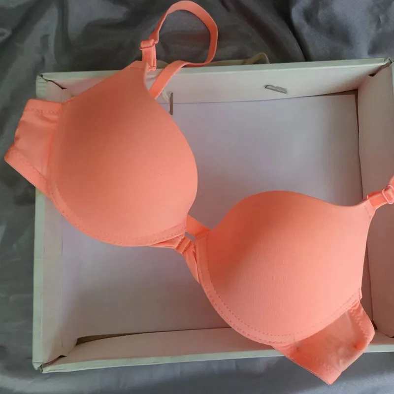 

Sujetador sin aros ni costuras de moda para mujer, lenceria Sexy sencilla de realce con cierre frontal y boton, ropa interior