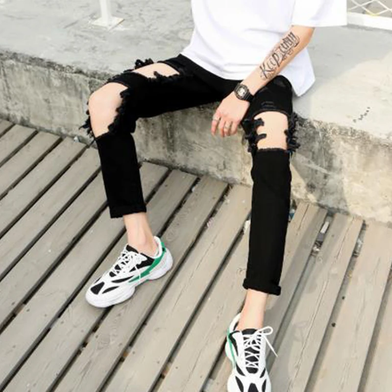 Men's jeans Spring/summer European-American beggar pants ripped pants men's slim skintight slacks hip-hop punk black hole pants