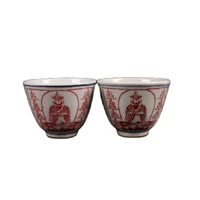 a pair of chinese jingdezhen ceramic cups with blue and white glaze and red figure pattern
