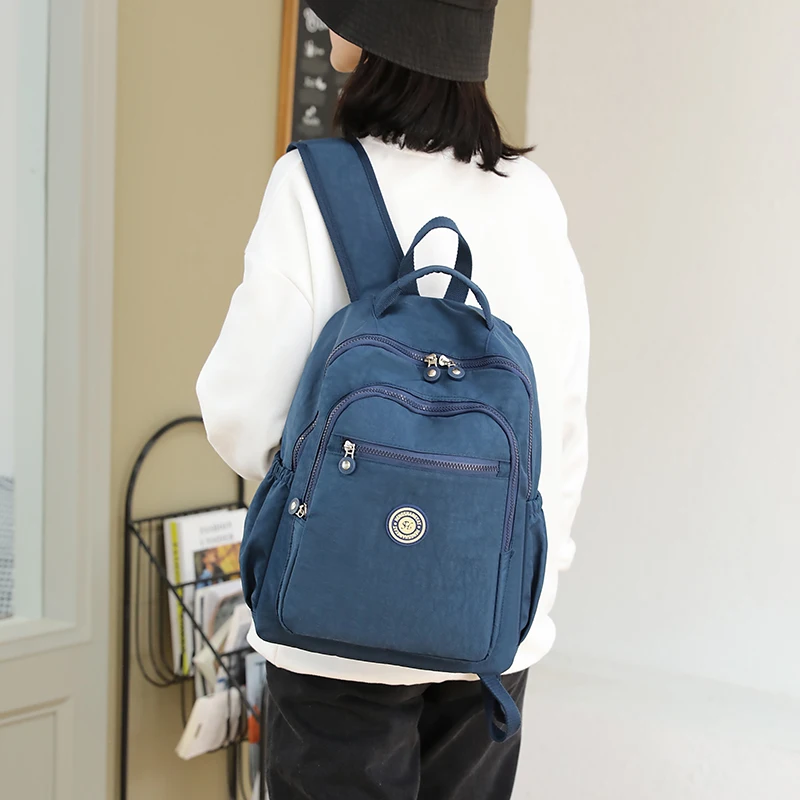 

2021 New Simple Solid Color Women Backpack Nylon College Student Schoolbag For Teenage Girl Fashion Backpack Travel Backpacks