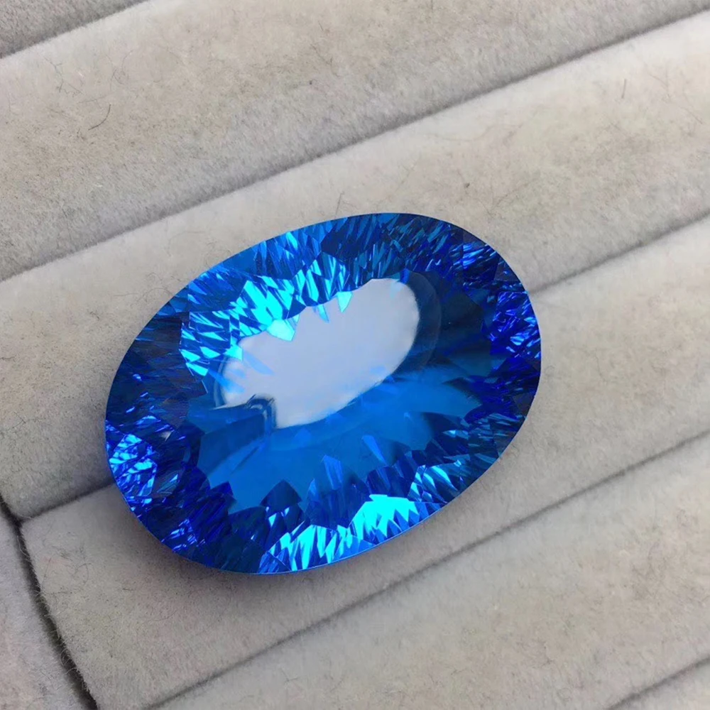 

Natural Swiss Blue Topaz Exquisite Concave Cut 56.42ct Specifications 27.8*19.6*12.4mm High-end Custom Ring Pendant Mosaic Stone