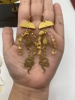 resin gold flake celestial brass sun snake earrings