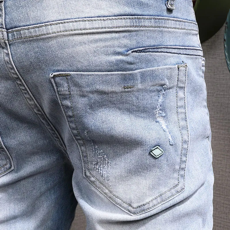 Korean Style Fashion Men Jeans Retro Light Blue Elastic Slim Fit Destroyed Ripped Jeans Men Streetwear Denim Punk Pencil Pants