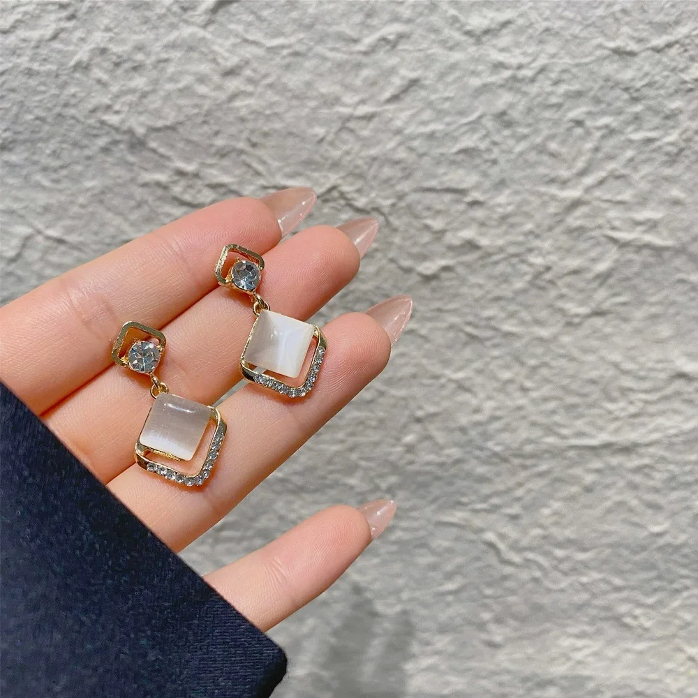 

Silver Needle Diamond Flashing Opal Earrings Japanese and Korean Temperament Design Light Luxury Style Hollow Earring Trend